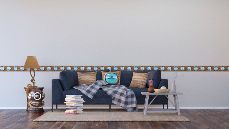 Wohnzimmer mit Sofa, Tisch und Bordüre mit Bullaugenmotiv