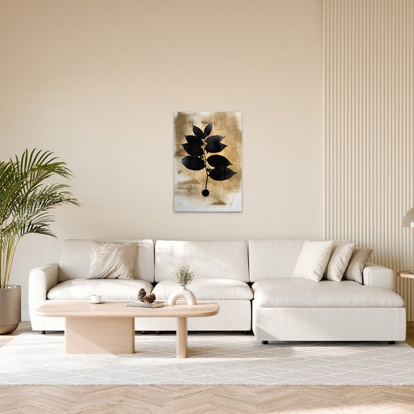 Modernes Wohnzimmer mit Leinwandbild eines Blattes über einem Sofa