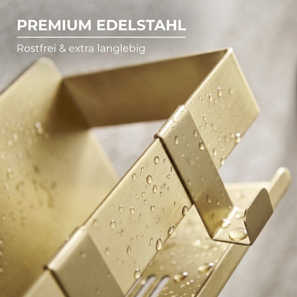 Detail eines Badaccessoires aus rostfreiem und langlebigem Edelstahl in Goldoptik mit Wassertropfen.