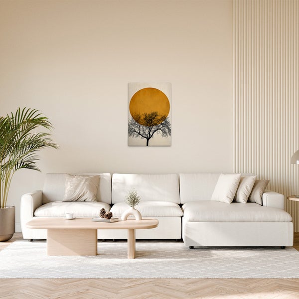Dekoratives Wandbild mit Baum vor Sonne im Wohnzimmer