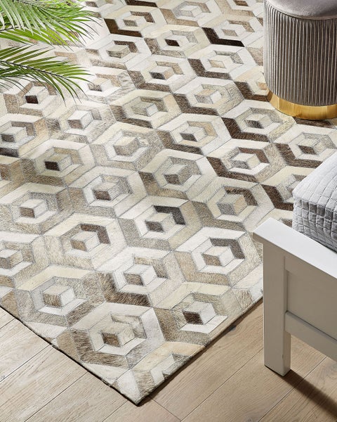 Teppich Kuhfell beige / braun 140 x 200 cm geometrisches Muster Kurzflor TAVAK