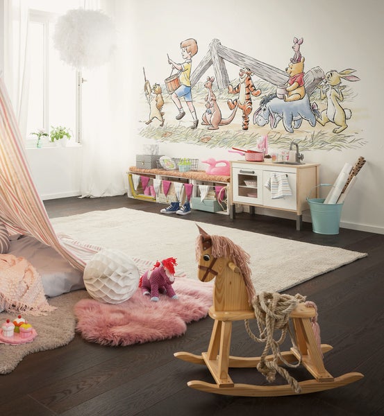 Verspieltes Kinderzimmer mit Wandbild, Spielzeug, Teppich und Spielzelt für eine gemütliche Atmosphäre