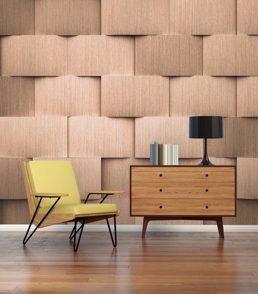 Fototapete mit 3D-Holzoptik in geometrischem Blockmuster in einem modern eingerichteten Wohnzimmer mit Sessel und Kommode.