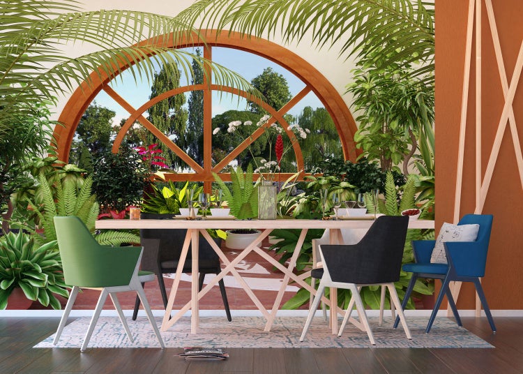 Esszimmer mit Esstisch, Stühlen und vielen Pflanzen für ein natürliches Ambiente