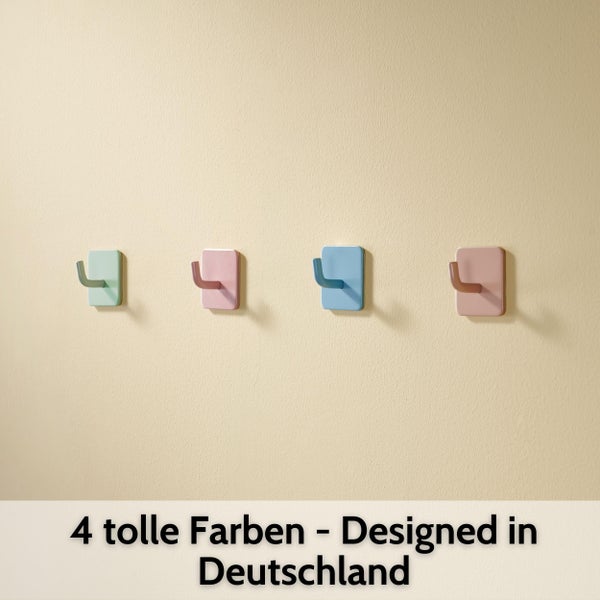 Vier farbige Wandhaken mit quadratischer Basis, entworfen in Deutschland.