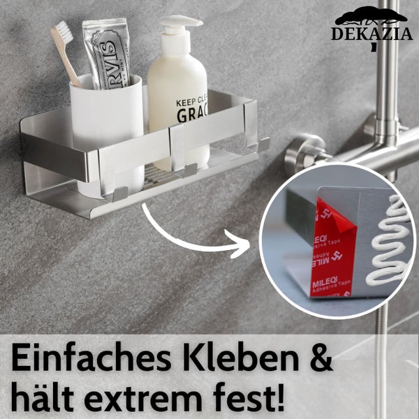 Selbstklebende Duschablage aus Edelstahl mit Becher und Seifenspender. Montage ohne Bohren durch Klebestreifen und Kleber. DEKAZIA Logo.