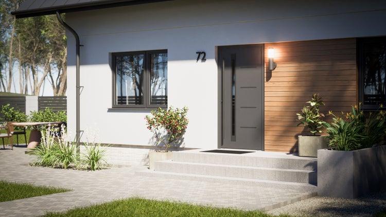 Moderne Hausfassade mit Steinstufenweg und gepflegtem Garten