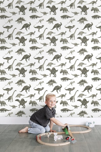 Zimmer mit Dinosaurier Tapete, Stuhl und Stofftieren