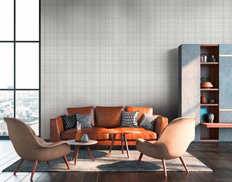 Wohnzimmer mit Sofa, Couchtisch, Dekoration und Backsteinmauer