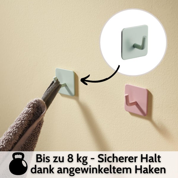 Quadratische selbstklebende Wandhaken mit angewinkeltem Design für sicheren Halt, Belastbarkeit bis zu 8 Kilogramm, ein Haken hält ein Handtuch.
