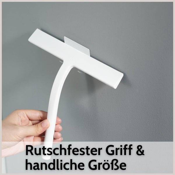 Weißer Duschabzieher mit rutschfestem Griff und handlicher Größe, gehalten von einer Hand.
