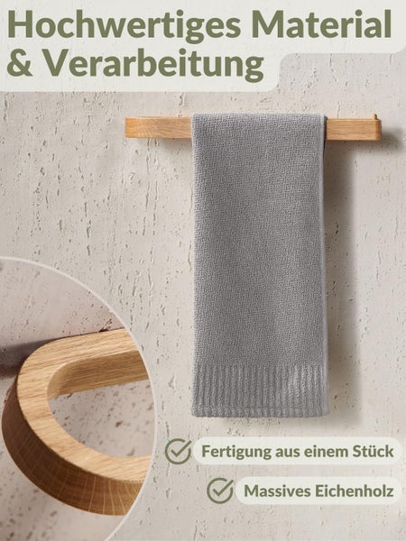 Handtuchhalter aus massivem Eichenholz mit abgerundeten Kanten, aus einem Stück gefertigt, an einer strukturierten Wand montiert.