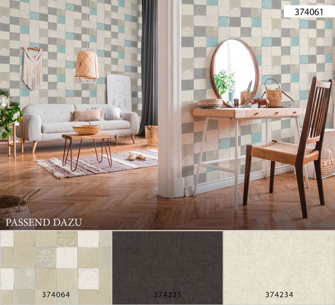 Blumenarrangement mit Narzissen, Primeln und anderen Frühlingsblumen in einem grauen Pflanzgefäß.