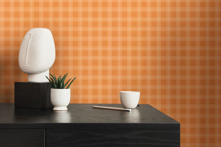 Orangefarbenes Textil mit Karomuster