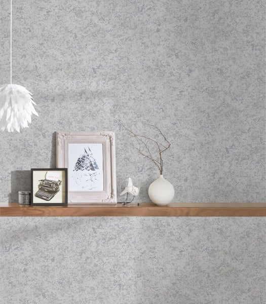 Detailansicht eines Grillgestells mit Grillbesteckhaken zur Aufbewahrung von Grillutensilien.