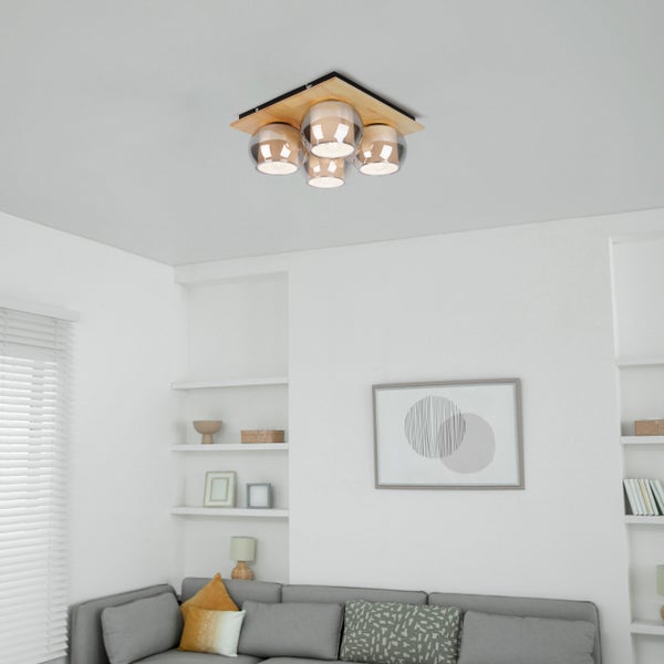 Deckenleuchte mit Holzsockel und mehreren Glühbirnen in einem Wohnzimmer