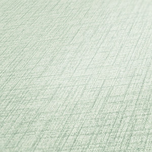 Wohnzimmer mit Rattan-Stuhl, Holzfußboden und dekorativen Elementen für eine natürliche Atmosphäre