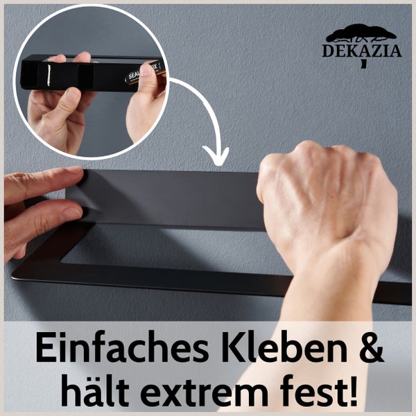 Schwarzer Wand-Küchenrollenhalter von Dekazia, an dem eine Hand eine Küchenrolle aufschiebt. Dekazia Logo.