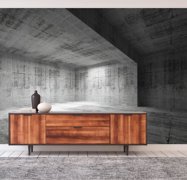 Fototapete mit 3D-Betonoptik eines industriellen Raumes hinter einem hölzernen Sideboard in einem modern eingerichteten Zimmer.