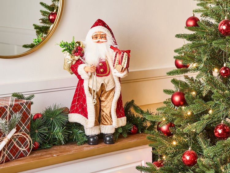 Dekorativer Weihnachtsmann mit Geschenk und Weihnachtsbaum für festliche Dekoration