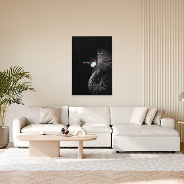 Dekoratives Leinwandbild mit einem Graukronenkranich im Wohnzimmer.