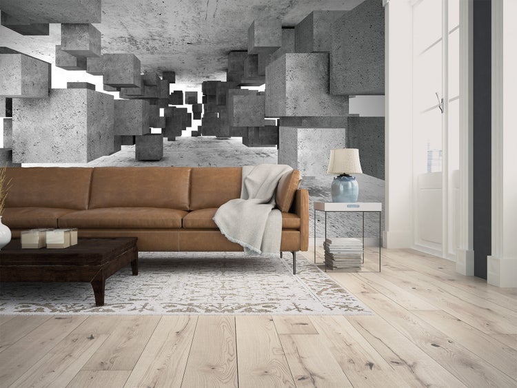 Moderne Wohnzimmergestaltung mit Fototapete in 3D-Optik, Betonwürfeln, braunem Ledersofa und hellem Holzboden.