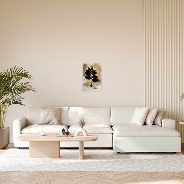 Dekoratives Wandbild mit Pflanzenmotiv im Wohnzimmer.