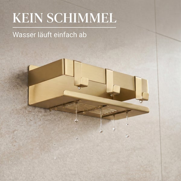 Wandmontierte goldfarbene Duschablage mit Haken und Wasserablauf zur Vermeidung von Schimmel.