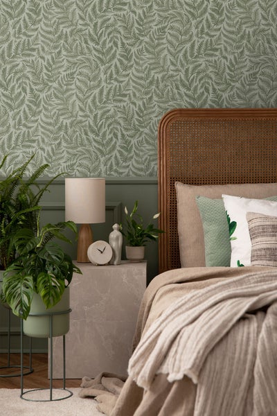 Küchenspüle mit Armatur, Gemüse und Ölflaschen auf einer Arbeitsplatte