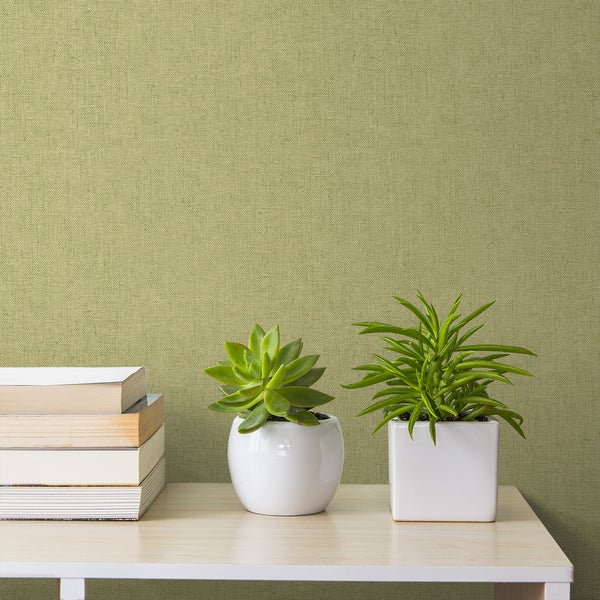 Tapete mit Pflanzen und Büchern auf einem Tisch