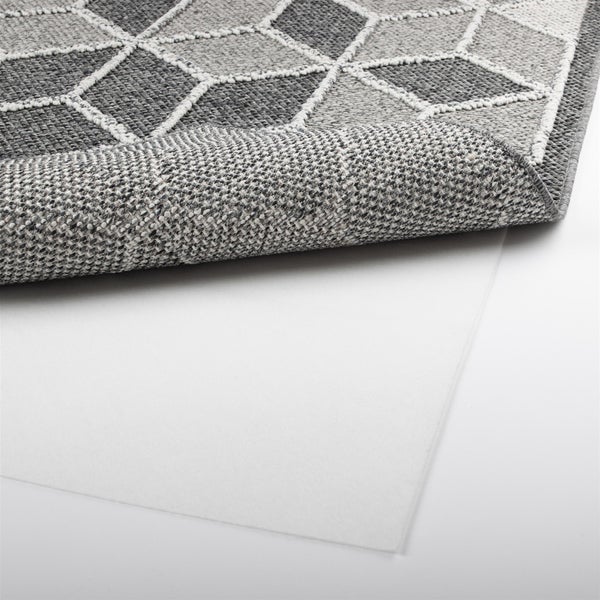 Antirutsch-Teppichunterlage unter einem grau gemusterten Teppich zur Fixierung auf glatten Böden.