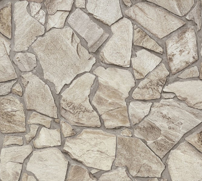 Wohnzimmer mit Couch, Kissen, Decken und Wandverkleidung in Steinoptik