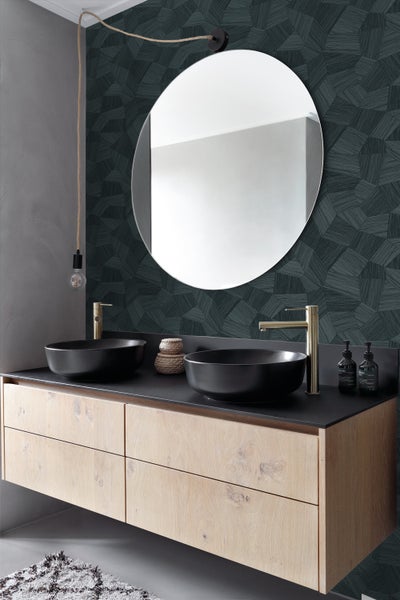 Modernes Badezimmer mit Doppelwaschtisch, runden Waschbecken und einem runden Spiegel.