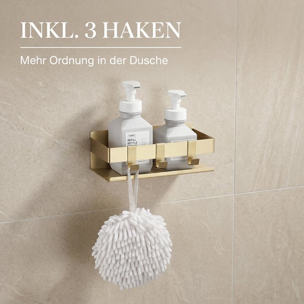 Duschablage aus Metall mit drei Haken, zwei Seifenspendern und einem Duschschwamm an einer gefliesten Wand.