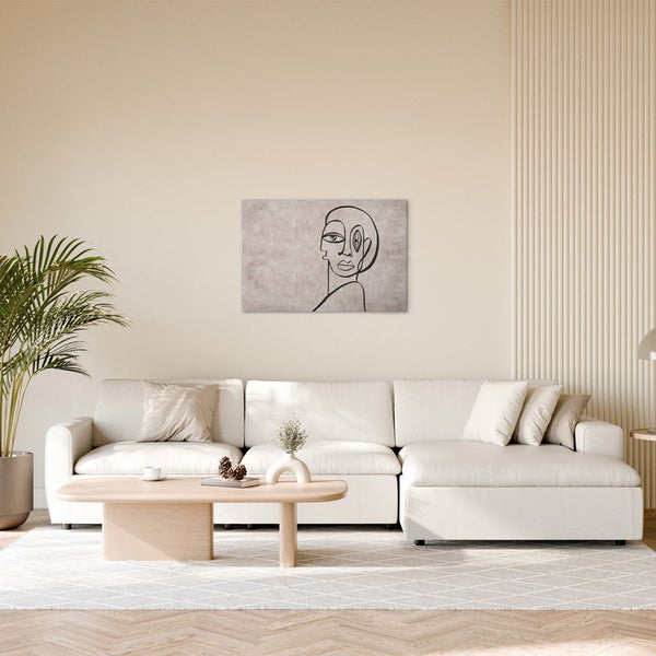 Wohnzimmer mit Sofa, Tisch und Leinwandbild mit Strichzeichnung