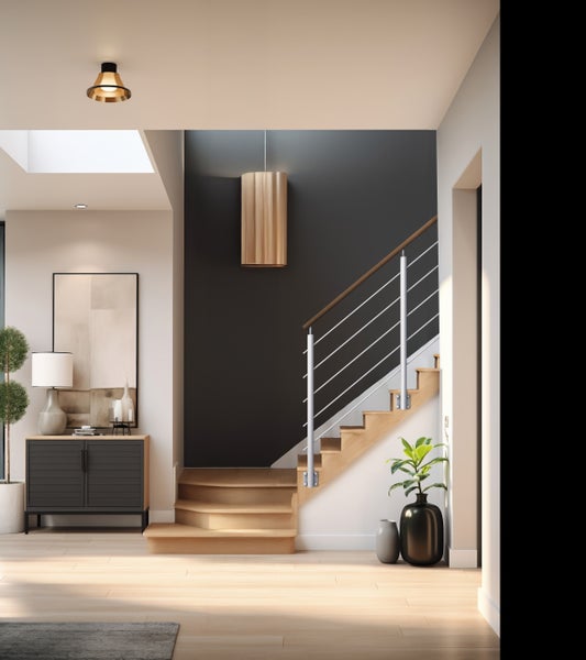 Innenaufnahme eines Flurs mit Treppe, Kommode und Dekorationen, helle und einladende Atmosphäre.