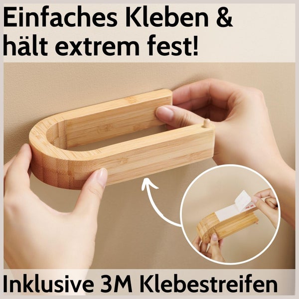 Montage eines Bambus-Toilettenpapierhalters an der Wand mit selbstklebenden 3M-Streifen ohne Bohren.
