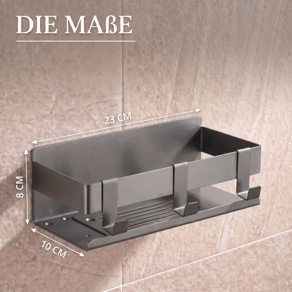 Wandmontiertes Duschregal aus Metall mit drei Haken und den Maßen: Länge 23 Zentimeter, Höhe 8 Zentimeter, Tiefe 10 Zentimeter.