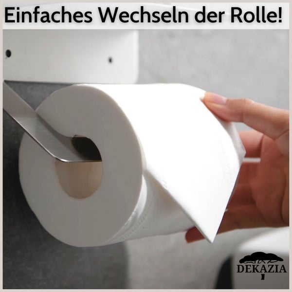 Eine Hand schiebt eine Rolle Toilettenpapier auf einen modernen Toilettenpapierhalter aus Metall. Einfacher Rollenwechsel. Dekazia Logo.