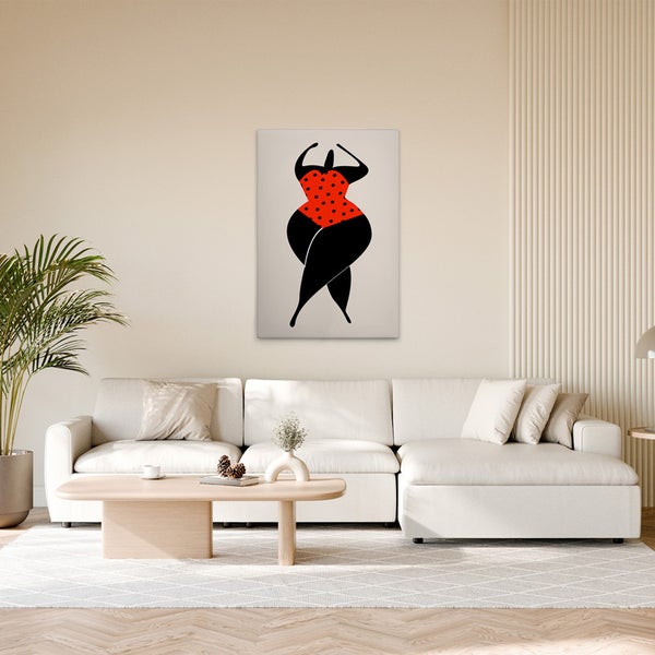 Dekoratives Leinwandbild mit abstrakter Frauenfigur in rotem Badeanzug mit schwarzen Punkten im Wohnzimmer.