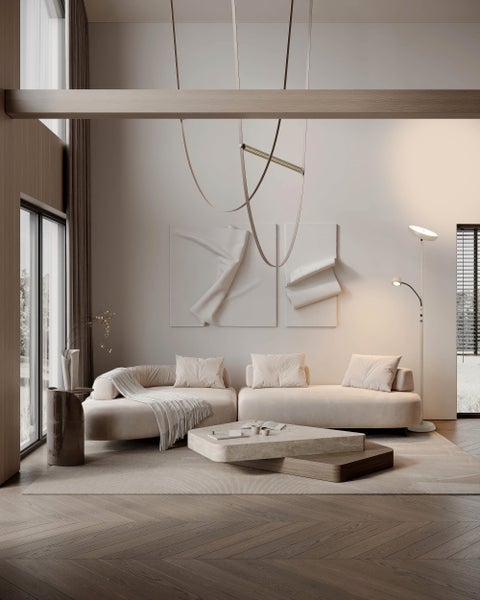 Stehleuchte mit Leselampe neben einem Sessel in einem Wohnzimmer