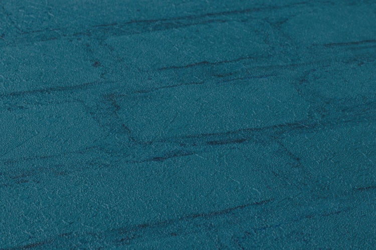 Nahaufnahme einer Tapete in Steinoptik.