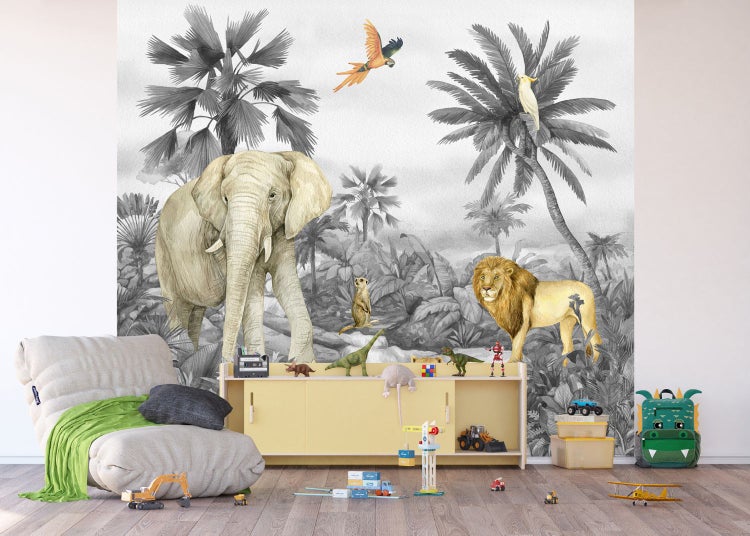 Tapete mit Dschungelmotiv, inklusive Elefant, Löwe und tropischer Vegetation in einem Kinderzimmer
