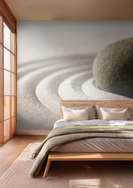 Ein Schlafzimmer mit einer Fototapete, die einen Steingarten darstellt.