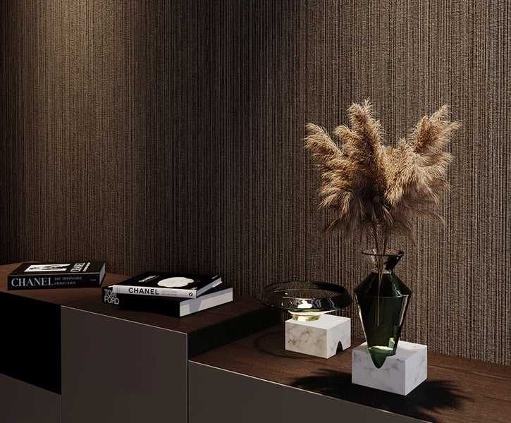 Dekorative Sichtschutzelemente aus Metall mit geometrischem Muster auf einer Terrasse.