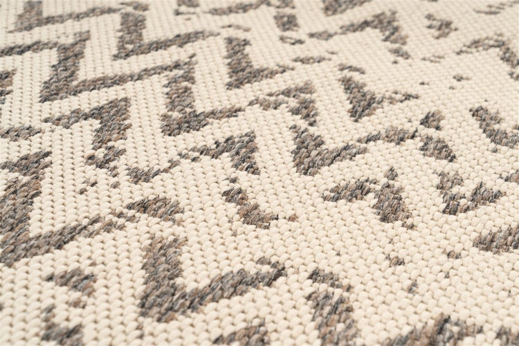 Webteppich mit Zickzack-Muster und strukturierter Oberfläche