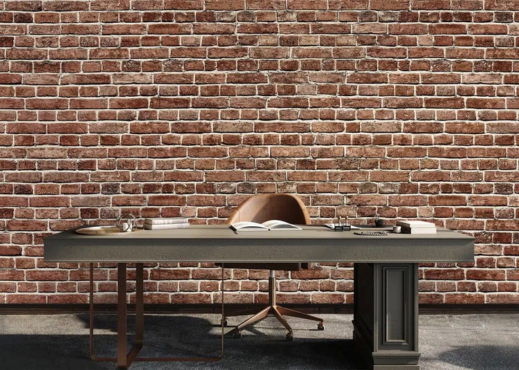 Fototapete mit Ziegelstein-Optik in einem modern gestalteten Arbeitszimmer mit Schreibtisch und Bürostuhl.