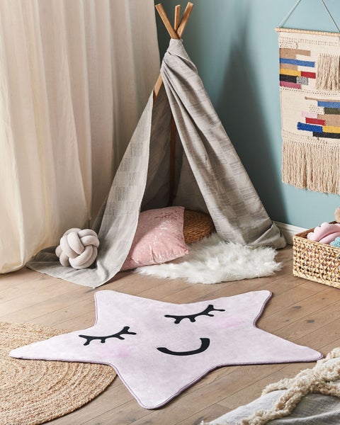 Sternförmiges Kissen mit Gesicht