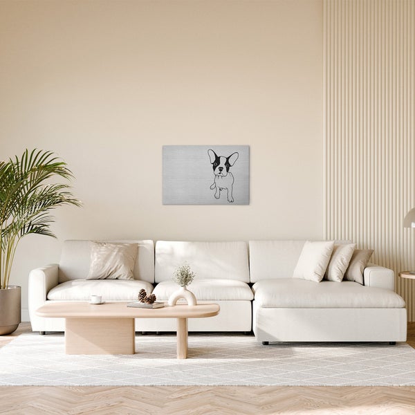 Wohnzimmer mit Sofa, Tisch und Wandbild mit Hundemotiv