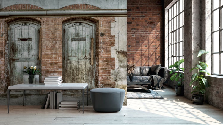 Fototapete im Loft-Stil mit Backsteinmauer und alten Holztüren in einem hellen Wohnzimmer mit industriellem Design.